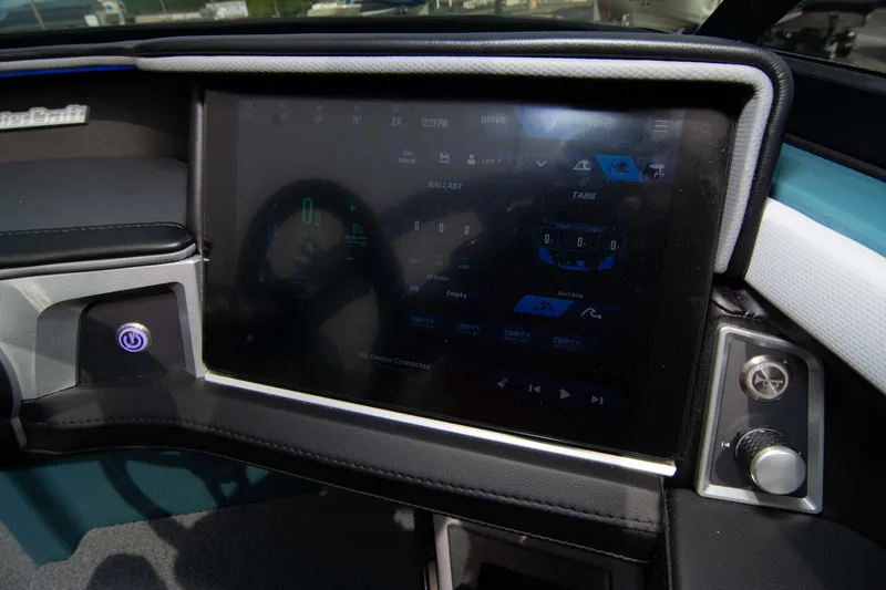 Slide: The Image of 2025 MasterCraft XT24 dashboard with touchscreen display and control panel. - 48