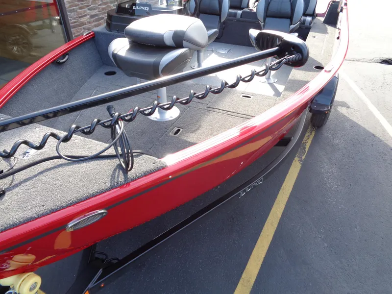 Slide: The Image of 2025 Lund 1650 Rebel XL SS boat, red exterior, spacious seating, and modern design. - 14