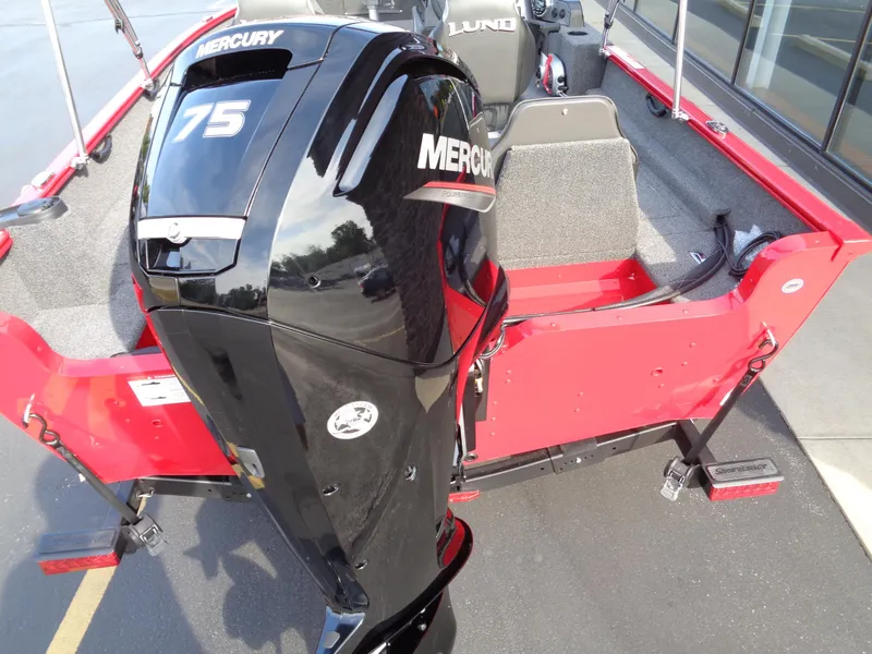 Slide: The Image of 2025 Lund 1650 Rebel XL SS boat with Mercury 75 outboard motor, red interior. - 7