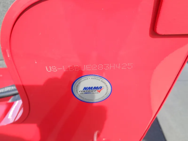 Slide: The Image of Red 2025 Lund 1650 Rebel XL SS boat with NMMA certification sticker and serial number. - 8