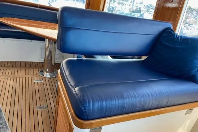 Slide: The Image of Luxurious interior seating of 2001 Grand Banks 49 Eastbay SX yacht with blue cushions. - 12