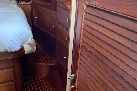 Slide: The Image of Interior of 2001 Grand Banks 49 Eastbay SX yacht with wooden cabinetry and bed. - 20