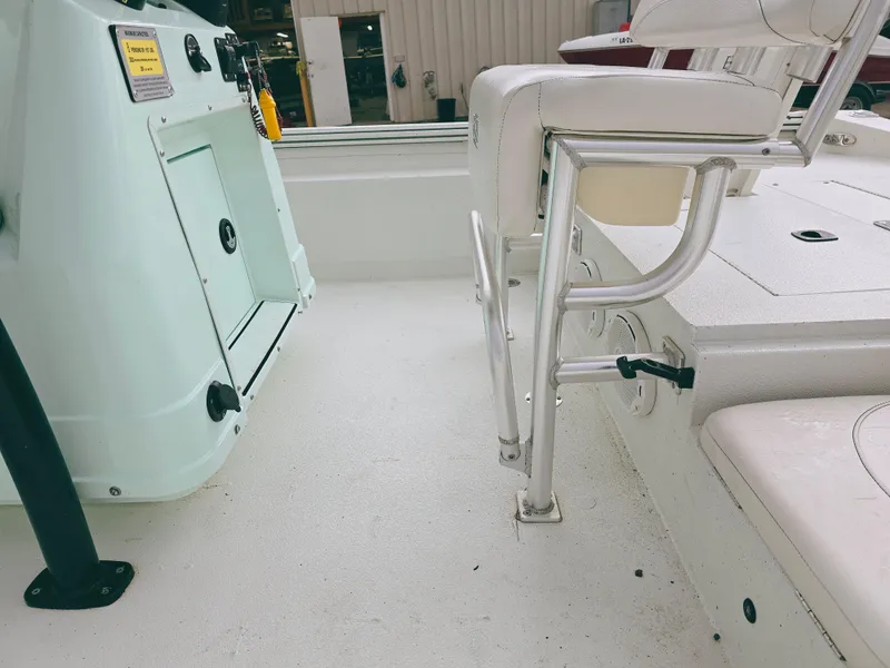 Slide: The Image of 2021 Excel Bay Pro boat interior with seating and storage compartments. - 10