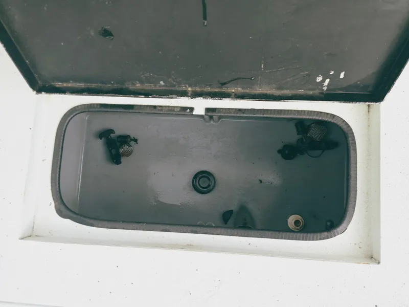 Slide: The Image of Open storage compartment in 2021 Excel Bay Pro boat. - 15