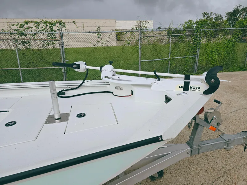Slide: The Image of 2021 Excel Bay Pro boat with Minn Kota trolling motor on trailer. - 9