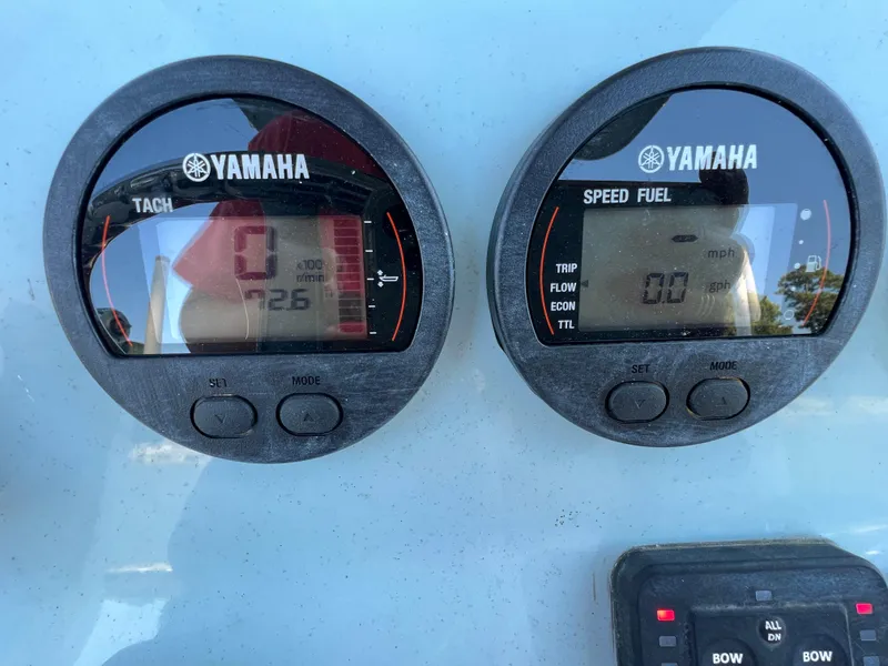 Slide: The Image of Yamaha tachometer and speed fuel gauges on 2021 Tidewater 232 LXF boat dashboard. - 14