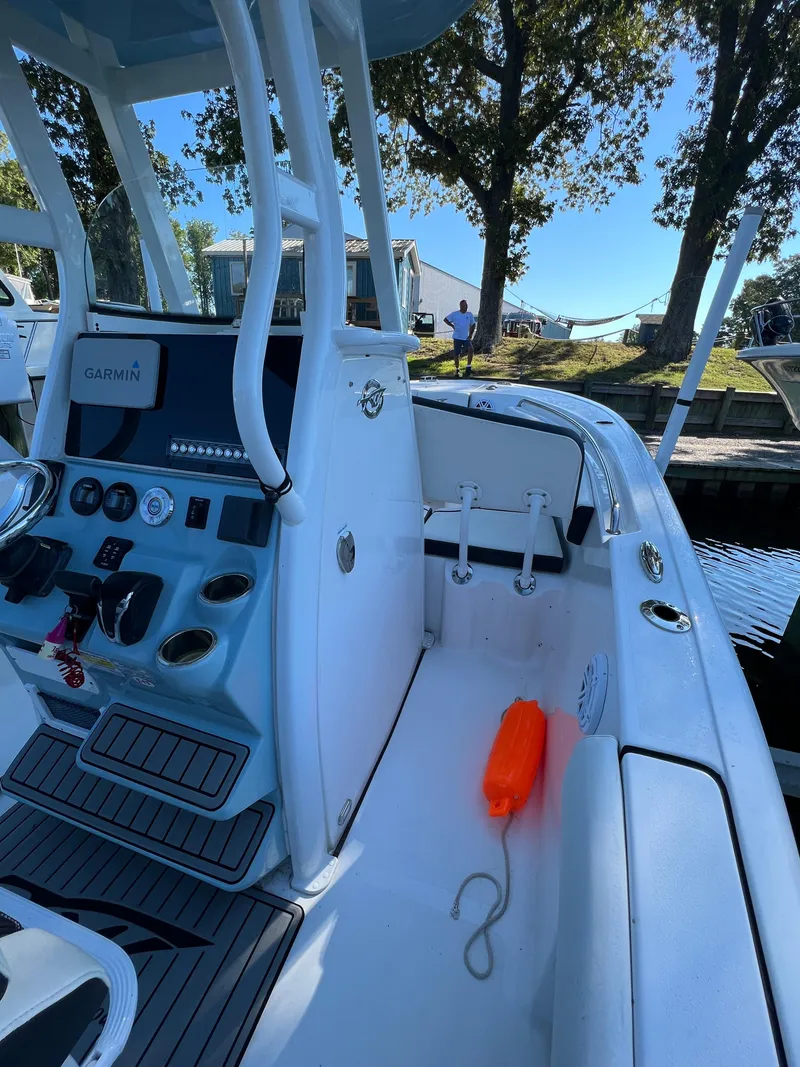 Slide: The Image of 2021 Tidewater 232 LXF boat interior with Garmin system and safety equipment. - 8