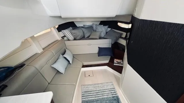 Slide: The Image of Interior of 2023 Sea Ray 370 Sundancer, featuring elegant seating and modern design. - 15