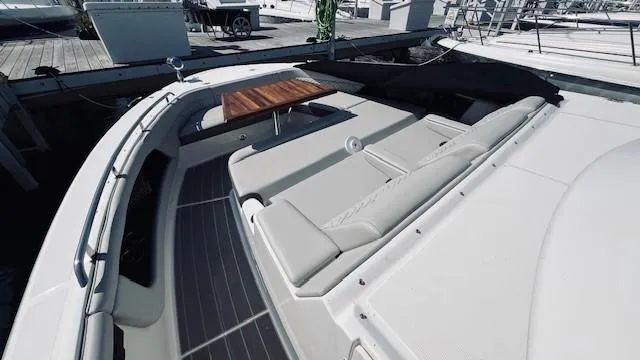 Slide: The Image of 2023 Sea Ray 370 Sundancer boat with spacious deck and seating area. - 16