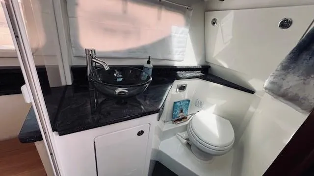 Slide: The Image of Luxurious bathroom in 2023 Sea Ray 370 Sundancer yacht with modern fixtures. - 21