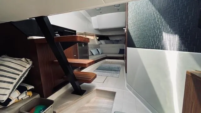 Slide: The Image of 2023 Sea Ray 370 Sundancer interior with modern design and comfortable seating. - 26
