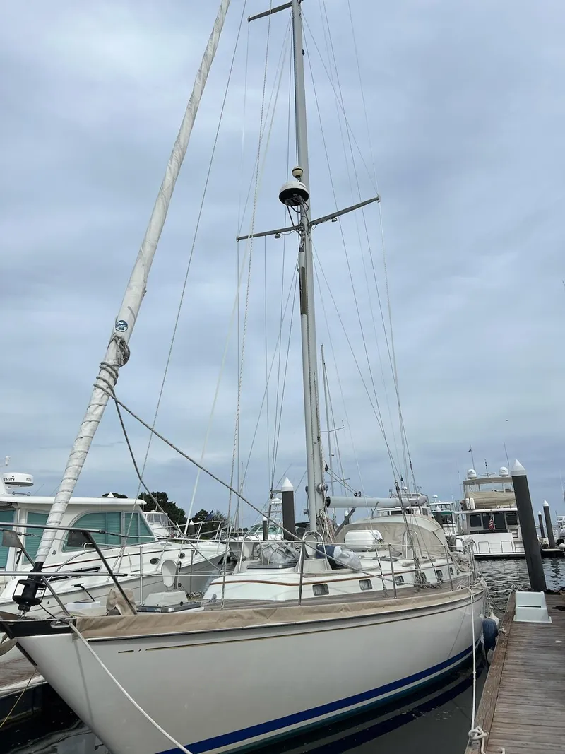 Slide: The Image of 1986 Little Harbor Aft Cockpit LH42 sailboat docked at marina. - 2