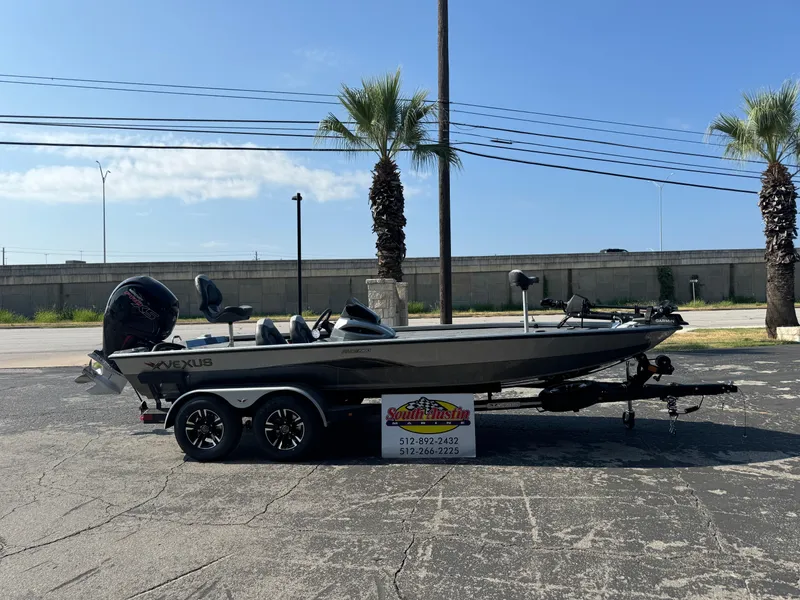 The Image of 2025 Vexus AVX1980 boat on trailer, parked outdoors with palm trees in background. - 1