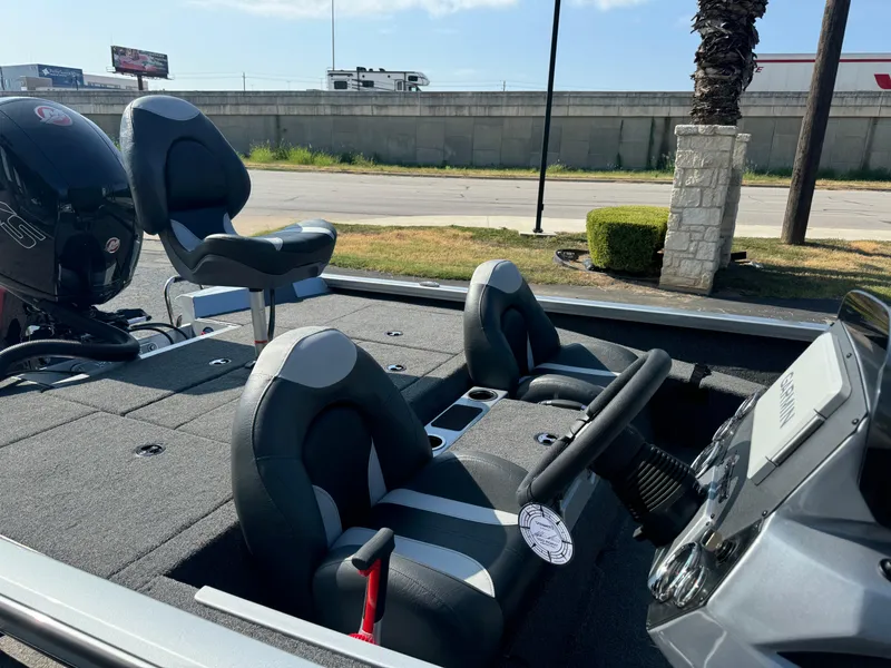 Slide: The Image of 2025 Vexus AVX1980 boat interior with modern seating and steering console. - 10