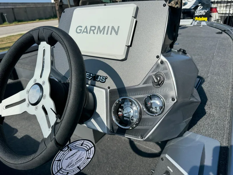 Slide: The Image of 2025 Vexus AVX1980 boat dashboard with Garmin navigation system and steering wheel. - 11