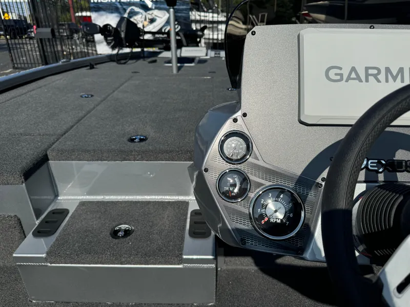 Slide: The Image of 2025 Vexus AVX1980 boat dashboard with Garmin display and RPM gauge. - 12
