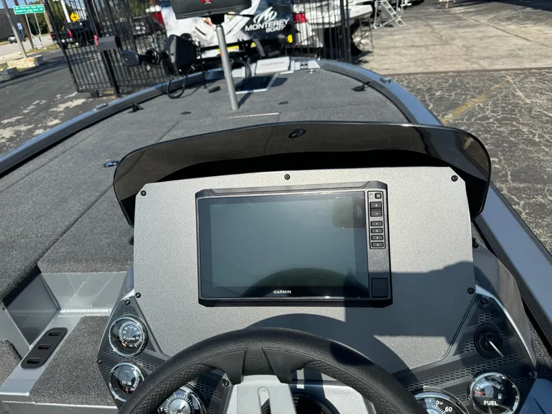 Slide: The Image of 2025 Vexus AVX1980 boat dashboard with Garmin display and steering wheel. - 13