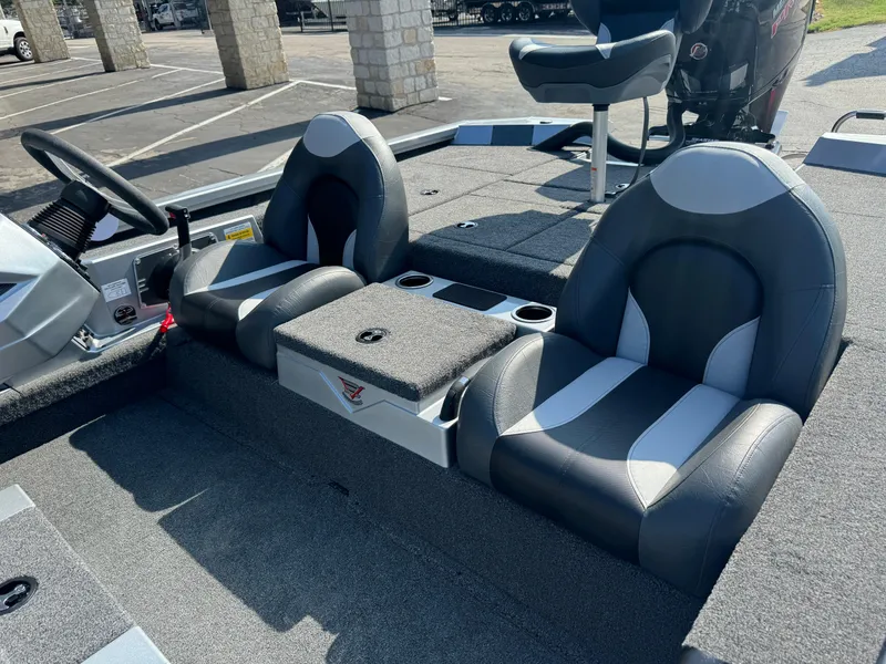Slide: The Image of 2025 Vexus AVX1980 boat interior with dual seats and steering console. - 16