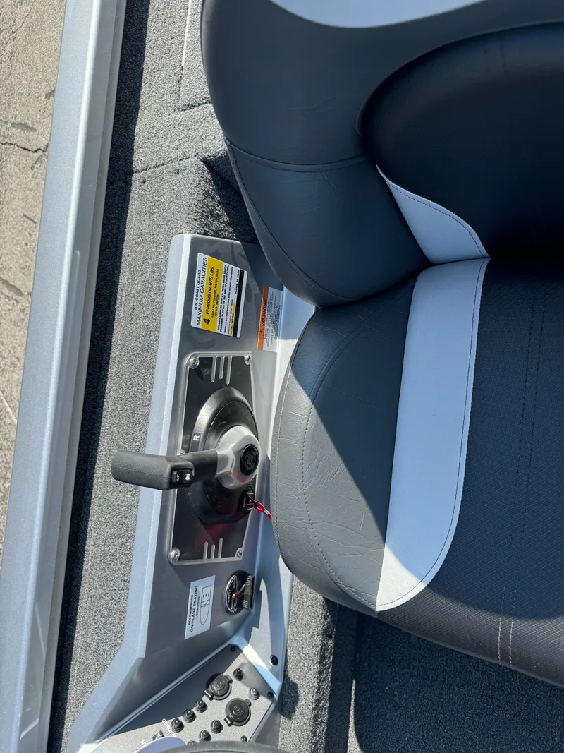 Slide: The Image of 2025 Vexus AVX1980 boat interior with control panel and seat detail. - 18