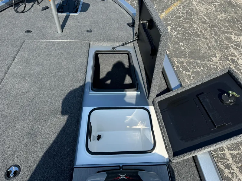 Slide: The Image of 2025 Vexus AVX1980 boat storage compartments with open lids on deck. - 24