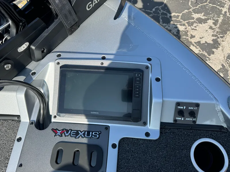 Slide: The Image of 2025 Vexus AVX1980 boat dashboard with Garmin display and control panel. - 26