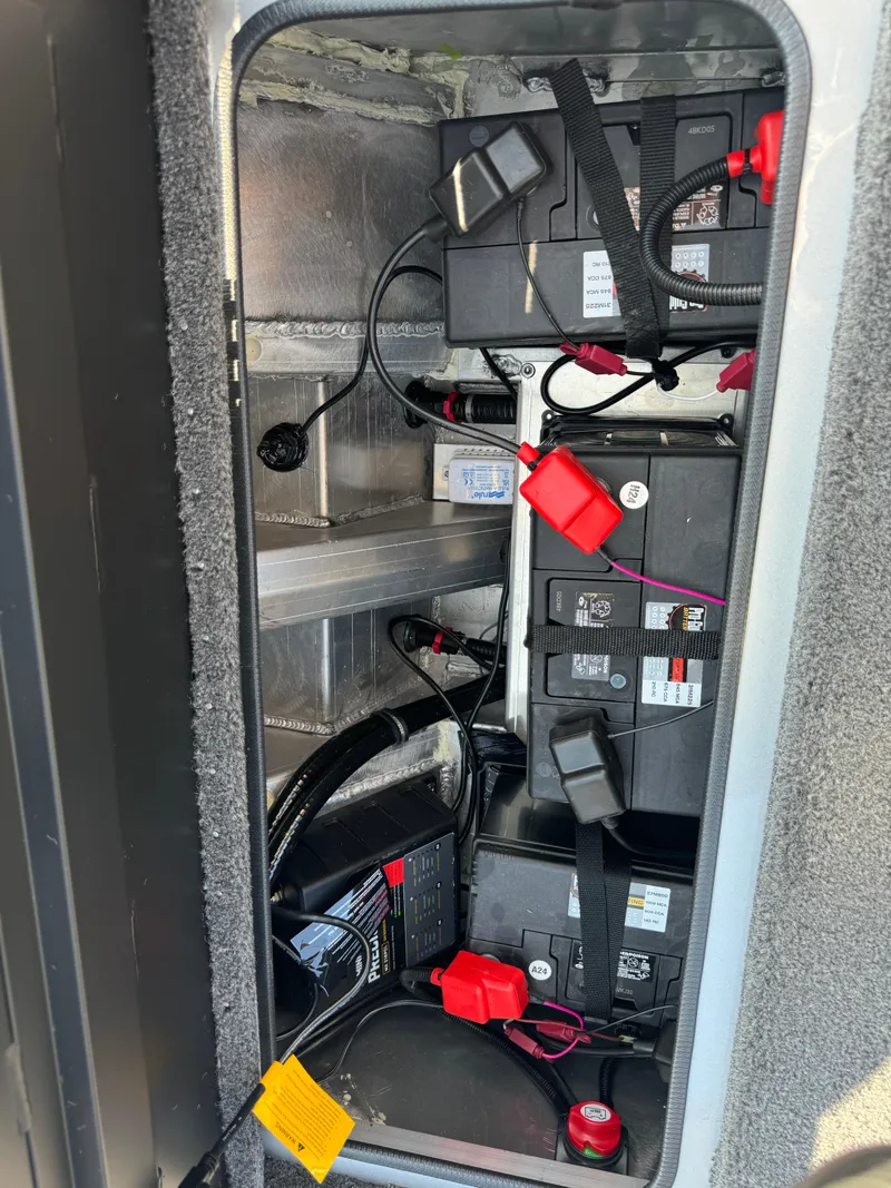 Slide: The Image of 2025 Vexus AVX1980 battery compartment with multiple batteries and wiring. - 35