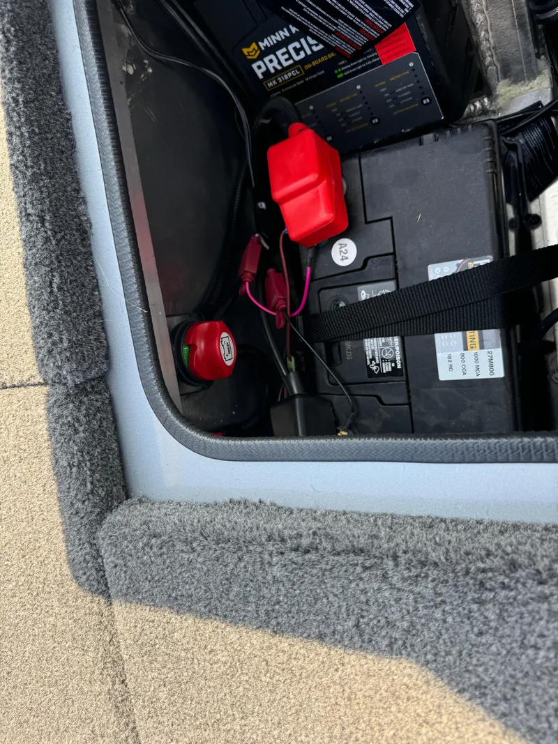 Slide: The Image of Battery compartment of 2025 Vexus AVX1980 boat with secure wiring and components. - 37