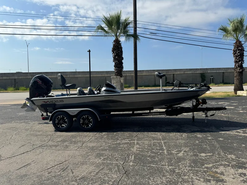 Slide: The Image of 2025 Vexus AVX1980 boat on trailer, parked outdoors under a clear sky. - 40