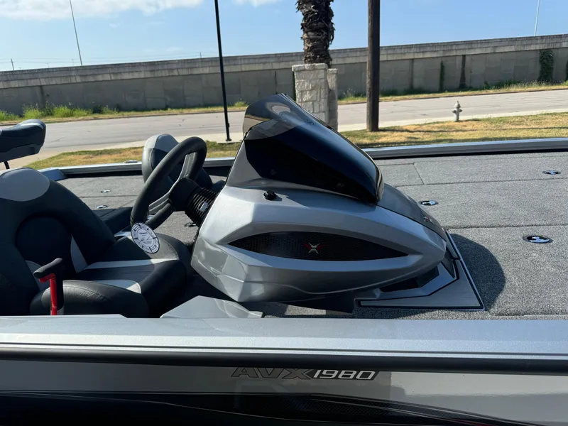 Slide: The Image of 2025 Vexus AVX1980 boat dashboard with steering wheel and console. - 8