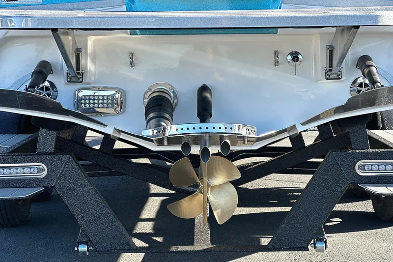 Slide: The Image of 2024 Centurion Ri230 boat stern with propeller and exhaust system. - 2
