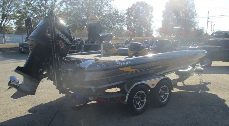 Slide: The Image of 2016 Triton 20 TRX boat with trailer in outdoor setting. - 4