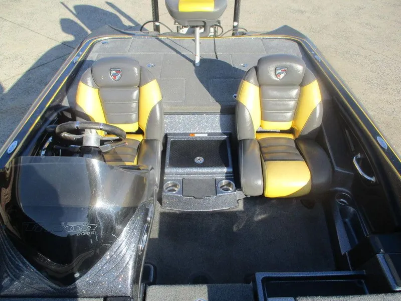 Slide: The Image of 2016 Triton 20 TRX boat interior with dual yellow and black seats. - 8