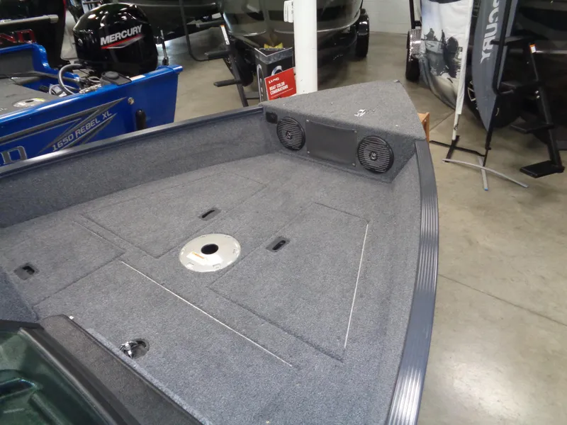 Slide: The Image of 2024 Lund 1650 Angler SS boat with seating, parked on snowy pavement. - 7