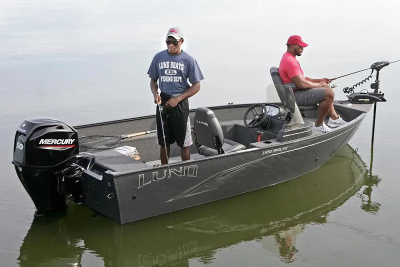 Slide: The Image of 2024 Lund 1650 Angler SS boat with Mercury engine, red exterior, and dual seats. - 9