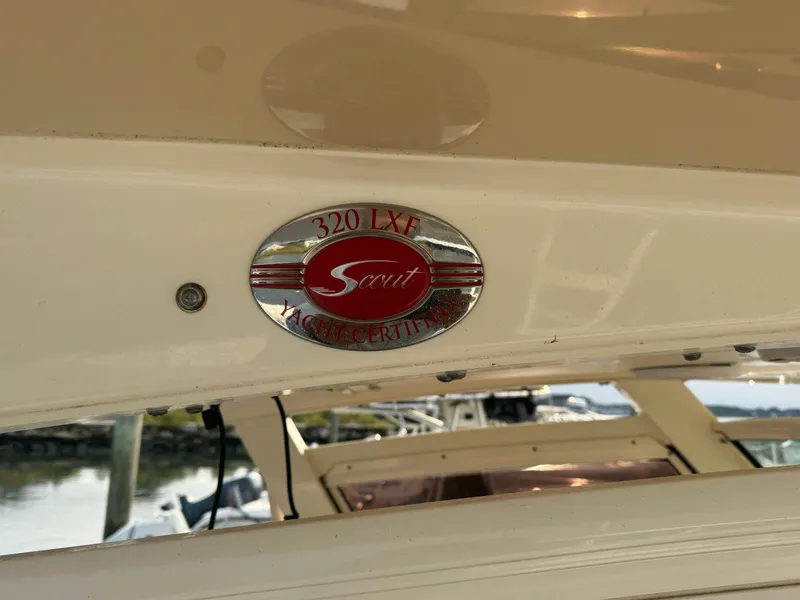Slide: The Image of 2015 Scout 320 LXF yacht certification badge on boat exterior. - 5
