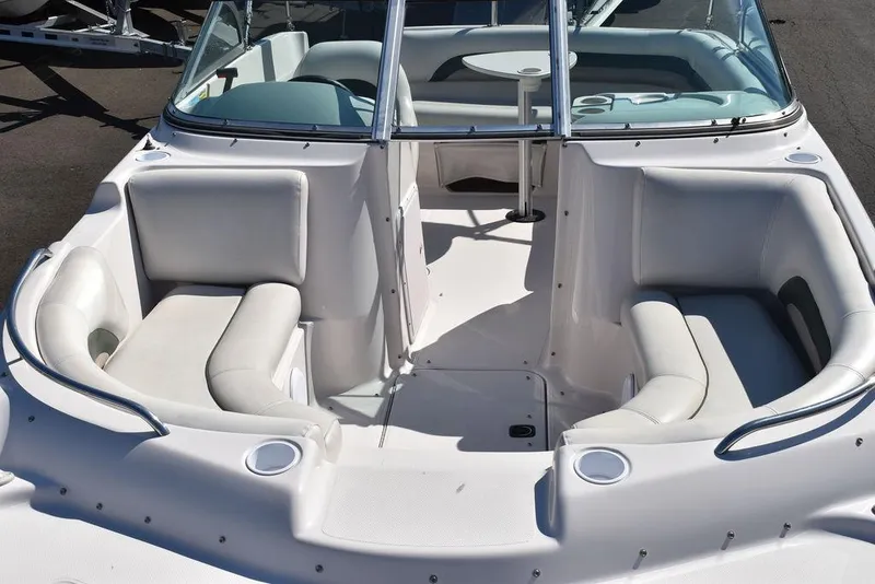 Slide: The Image of 2003 Hurricane SD 187 boat interior with white seating and cup holders. - 14