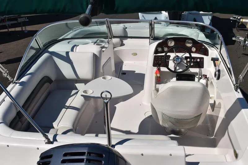 Slide: The Image of 2003 Hurricane SD 187 boat interior with seating, steering wheel, and dashboard. - 15