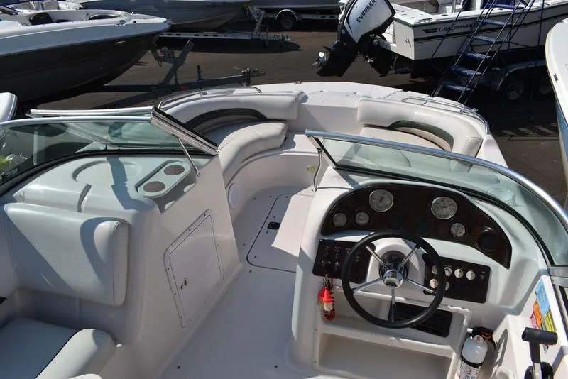 Slide: The Image of 2003 Hurricane SD 187 boat interior with steering wheel and seating area. - 18