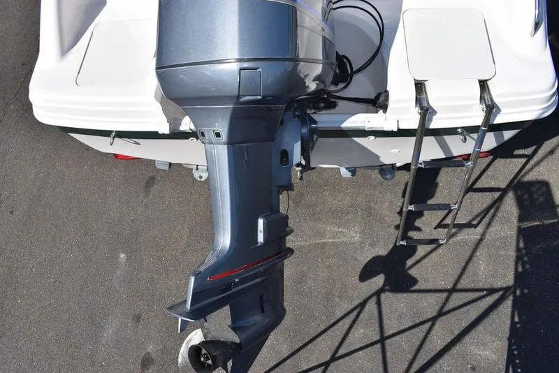Slide: The Image of 2003 Hurricane SD 187 boat with outboard motor and ladder, viewed from above. - 20