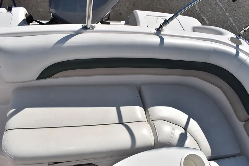 Slide: The Image of 2003 Hurricane SD 187 boat interior with white cushioned seating. - 27