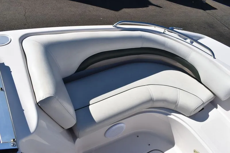Slide: The Image of 2003 Hurricane SD 187 boat interior with white cushioned seating and stainless steel rail. - 30