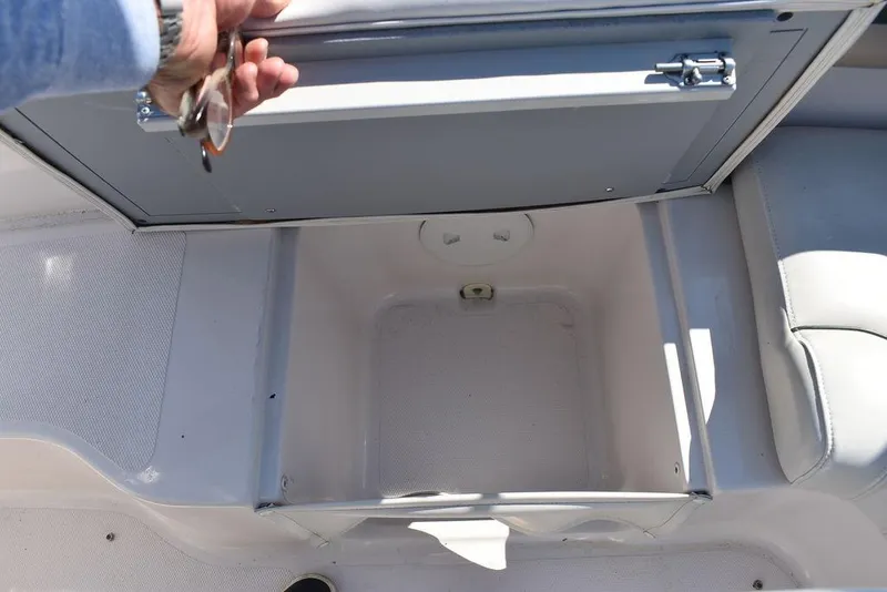 Slide: The Image of Open storage compartment on a 2003 Hurricane SD 187 boat, showcasing interior space. - 36