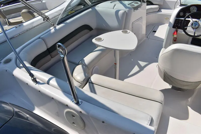 Slide: The Image of Interior of a 2003 Hurricane SD 187 boat with seating and steering wheel. - 38