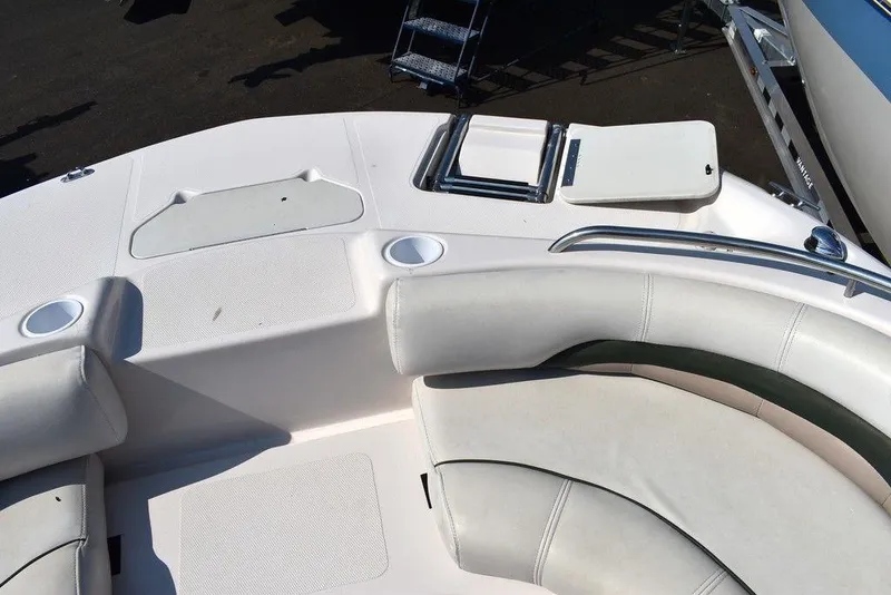 Slide: The Image of 2003 Hurricane SD 187 boat interior with white seating and cup holders. - 40