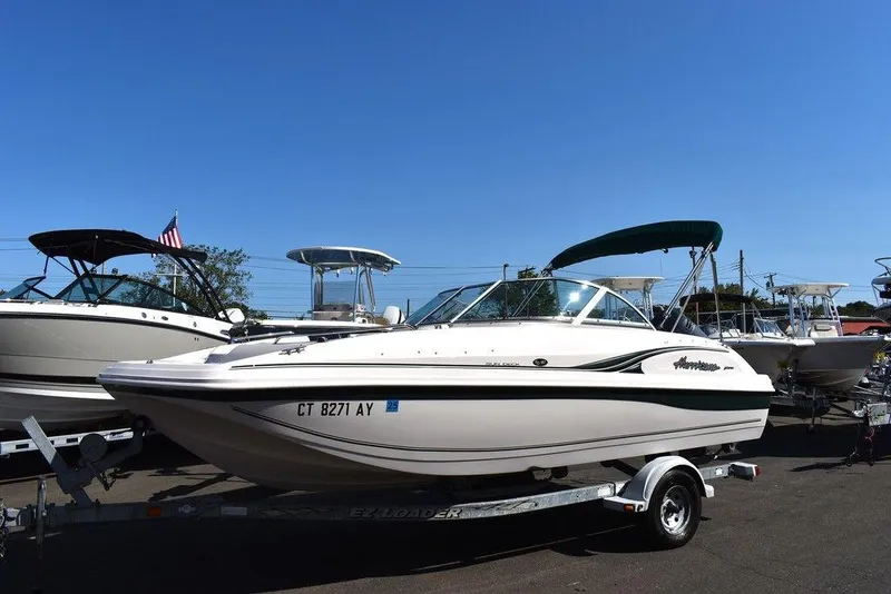 Slide: The Image of 2003 Hurricane SD 187 boat on trailer under clear blue sky. - 5