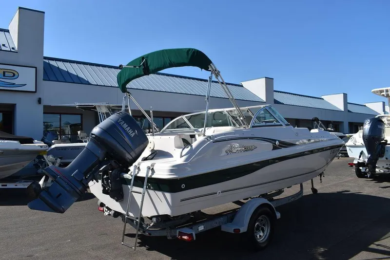 Slide: The Image of 2003 Hurricane SD 187 boat with Yamaha outboard motor on trailer, parked at dealership. - 8