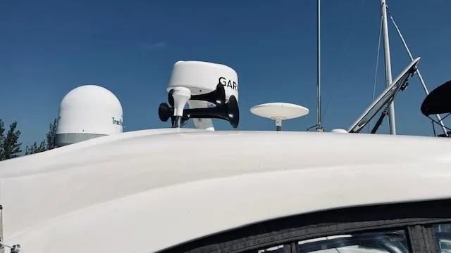 Slide: The Image of 2005 Sea Ray 39 Sundancer boat with radar and satellite equipment on deck. - 14