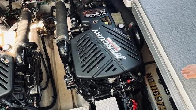 Slide: The Image of Engine compartment of 2005 Sea Ray 39 Sundancer with Mercury engines. - 17