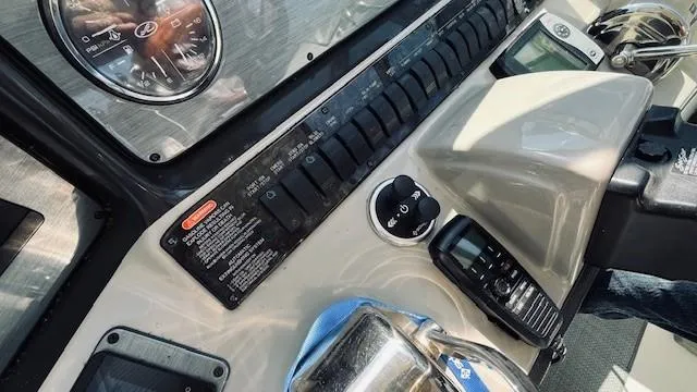 Slide: The Image of Control panel of a 2005 Sea Ray 39 Sundancer boat with gauges and radio equipment. - 3