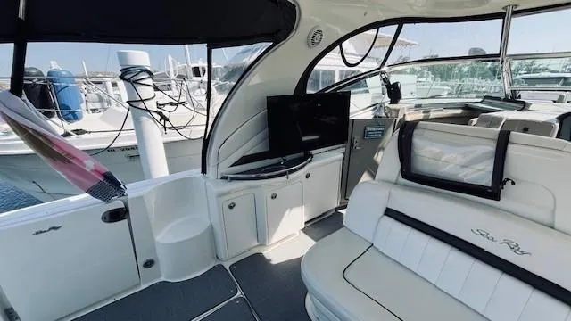 Slide: The Image of Interior of 2005 Sea Ray 39 Sundancer yacht with seating and TV, docked at marina. - 4